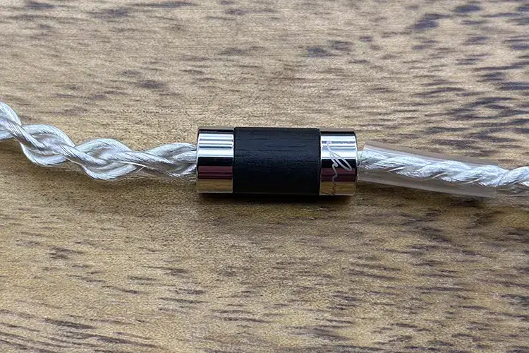 Luminox Audio Tri-light cable splitter on wood table