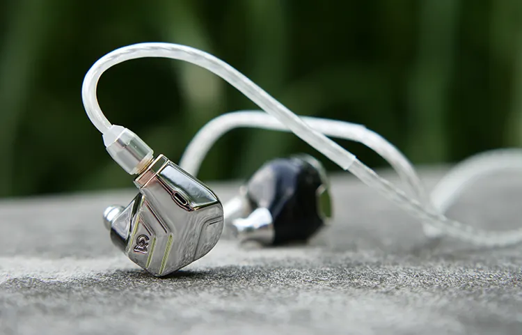 Campfire Audio Astrolith with its cable on a rock