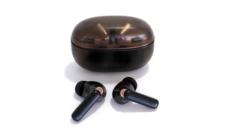 Creative Aurvana Ace 2 earbuds in front of cradle