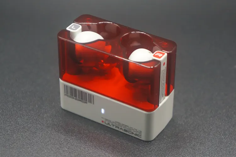 MOONDROP Ultrasonic earbuds in red cradle