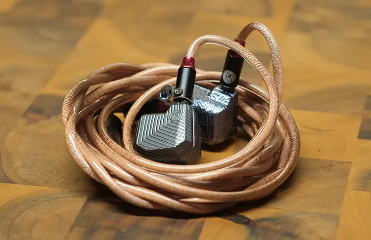 PLUSSOUND VOLTA IEM with cable on wooden floor