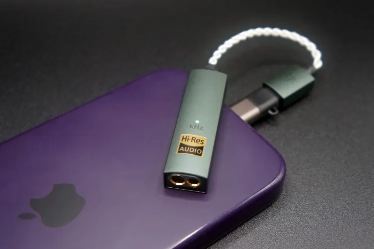 iFi audio GO link Max on top of purple iPhone