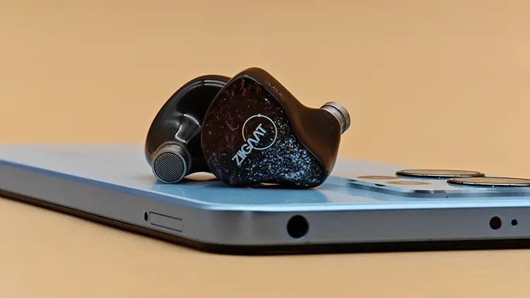 ZiiGaat Odyssey on top of blue smartphone