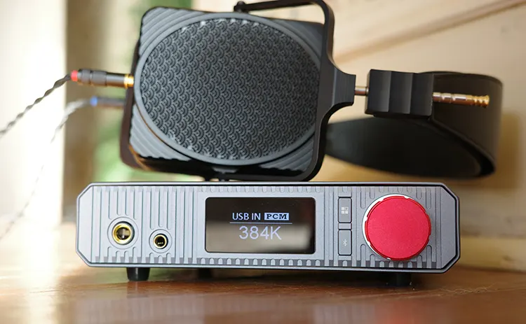 xDuoo XA-02 with headphones on top