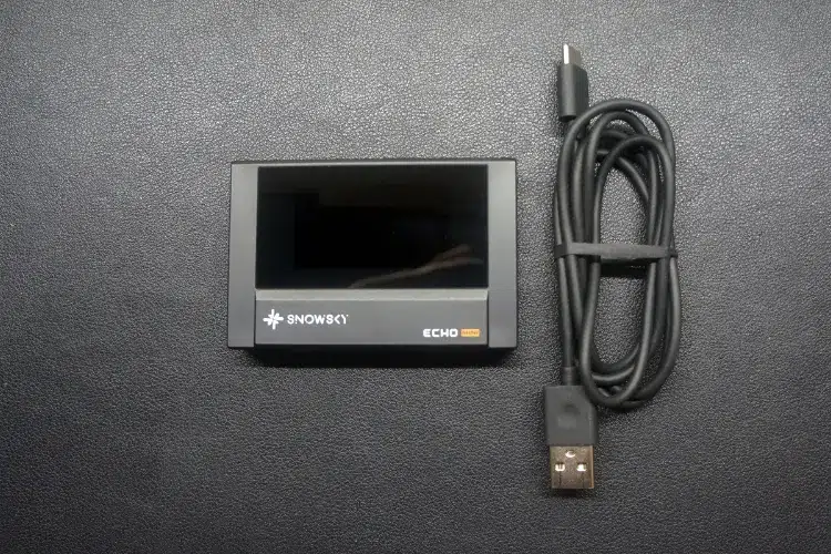 FiiO SNOWSKY ECHO MINI beside a USB cable