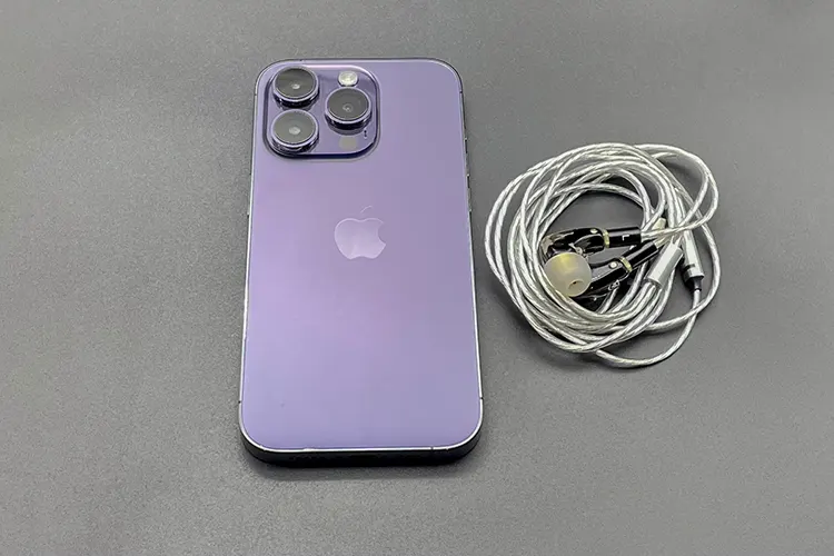 Campfire Audio Axion beside iPhone