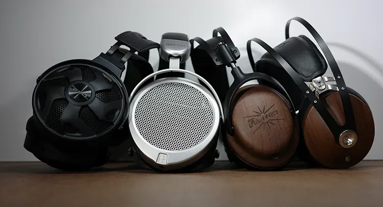 Kiwi Ears Atheia beside 3 other headphones