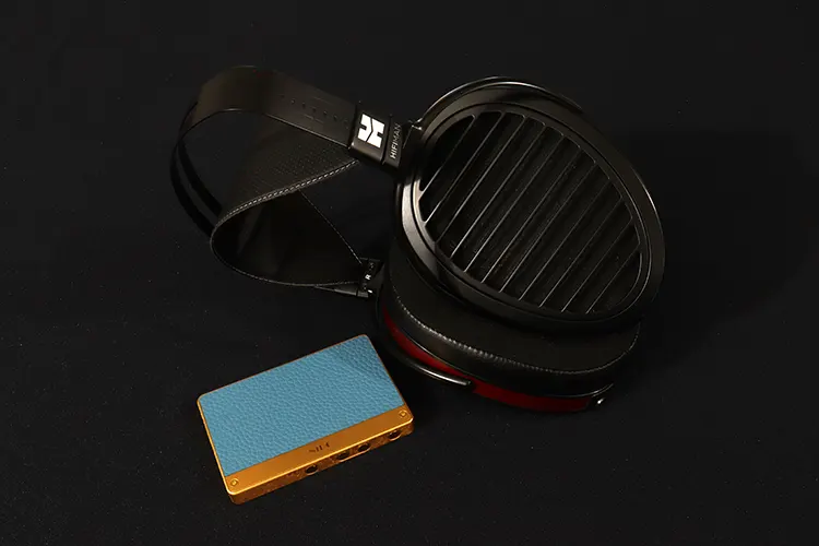 NiPO A100 beside HIFIMAN Headphones