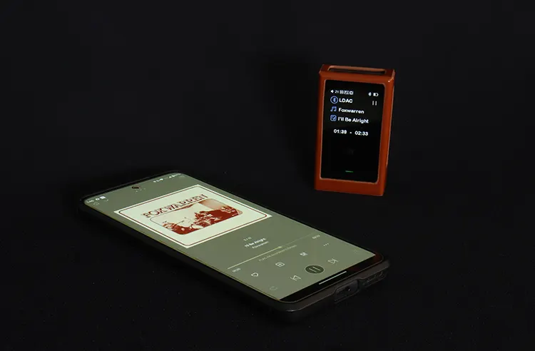 Shanling UP6 beside a smartphone