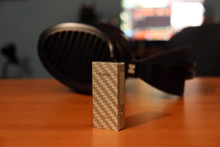 FiiO QX13 in front of HIFIMAN Arya Organic headphones