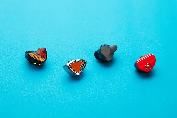 Hidizs MS2 PRO beside 3 other IEMs