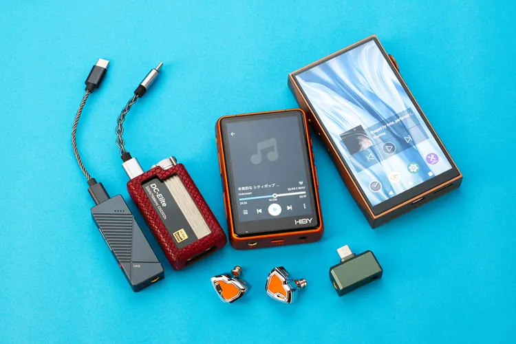 Hidizs MS2 PRO beside numerous dongles and DAPs