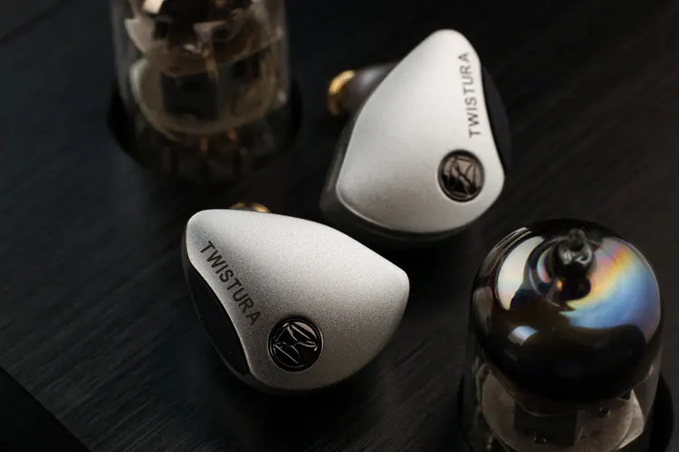 Twistura Woodnote shells between 2 tubes