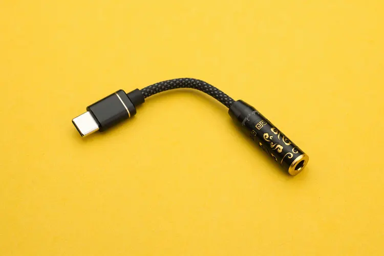FiiO JIEZI dongle DAC on yellow background