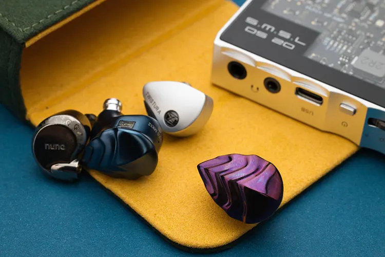 Hidizs MK12 Turris Titanium Edition IEM beside 3 IEMs