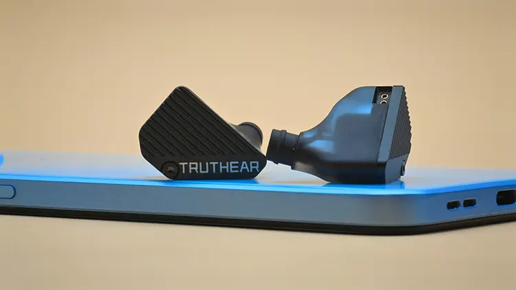 TRUTHEAR PURE on top of blue smartphone