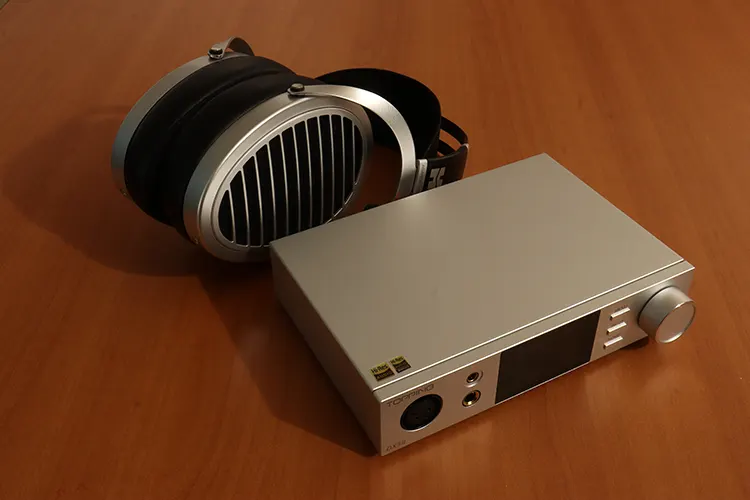 Topping DX5 II beside HIFIMAN headphones