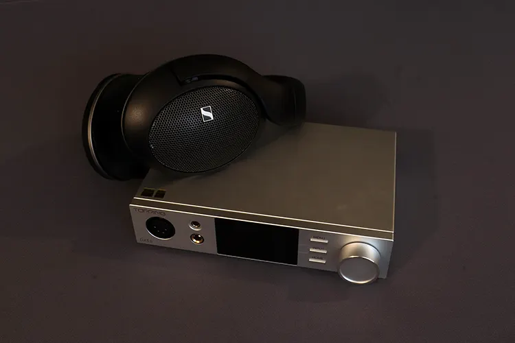 Topping DX5 II beside Sennheiser headphones