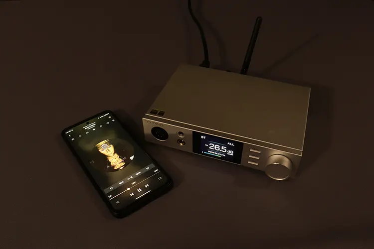 Topping DX5 II beside a Smartphone