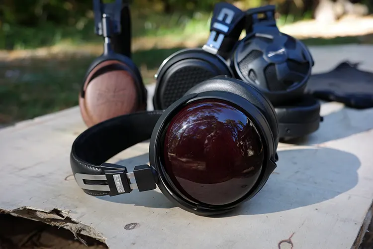 FiiO FT13 headphones on their side on top of a cardboard box