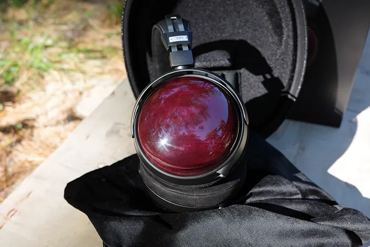 FiiO FT13 headphones upright inside its open carry case