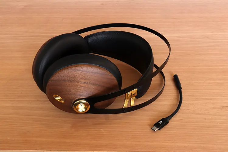 Meze Audio 99 Classics 2nd Generation beside its dongle DAC