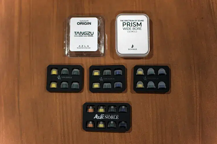 TANGZU The Monkey King ear tips on wooden table