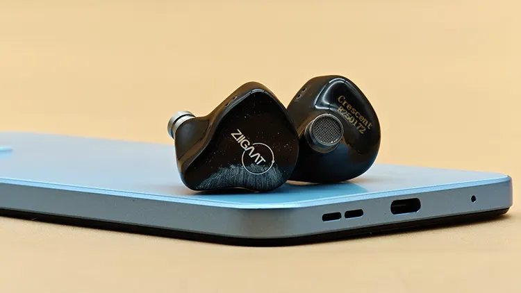 ZiiGaat Crescent shells on top of a blue smartphone