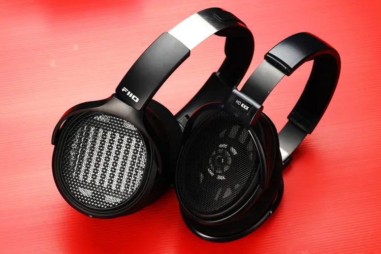 FiiO JT7 headphones beside the Sennheiser HD 6XX headphones