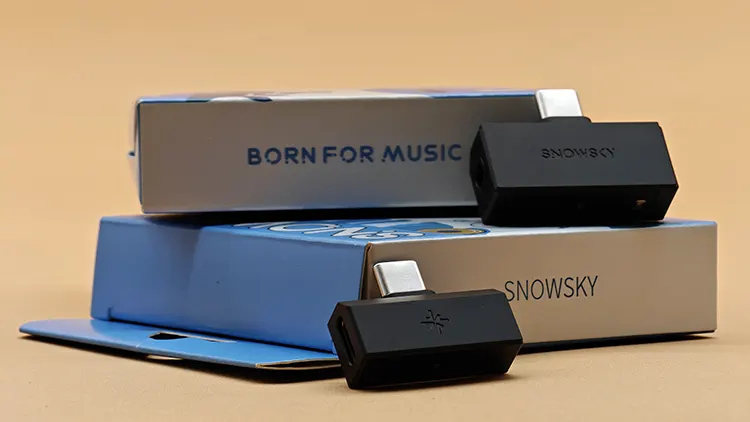 FiiO SNOWSKY Tiny A and B dongles on top of their boxes