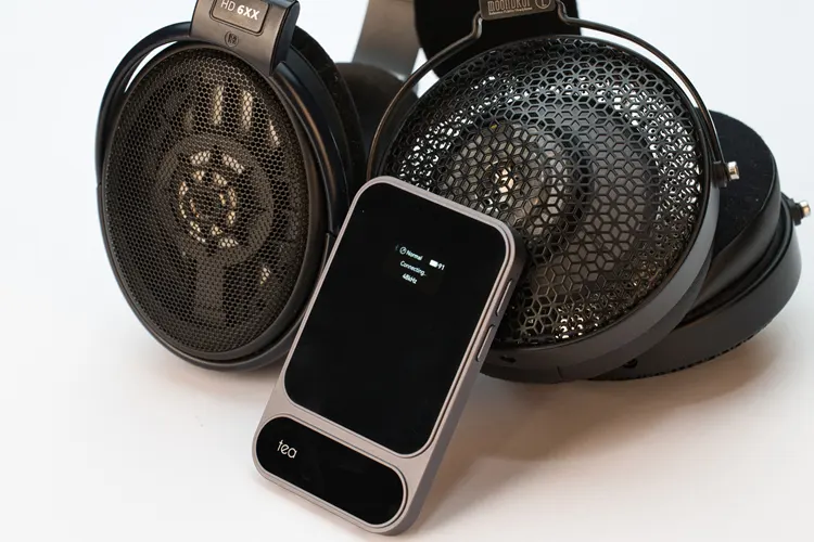 Khadas Tea Pro beside 2 headphones