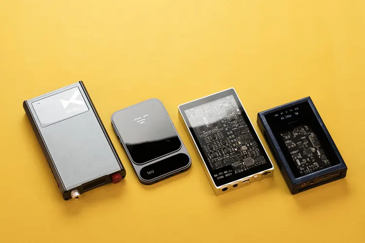 Khadas Tea Pro beside 3 portable amplifiers