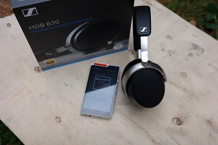 Sennheiser HDB 630 headphones beside their retail box and HiBy R4 DAP