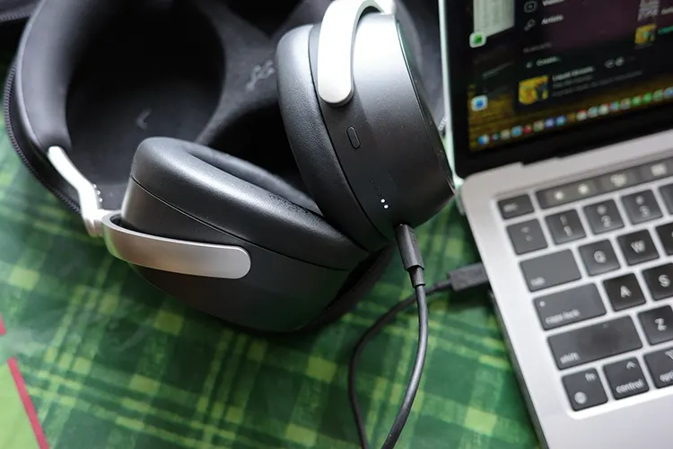 Sennheiser HDB 630 headphones connected to a MacBook Pro