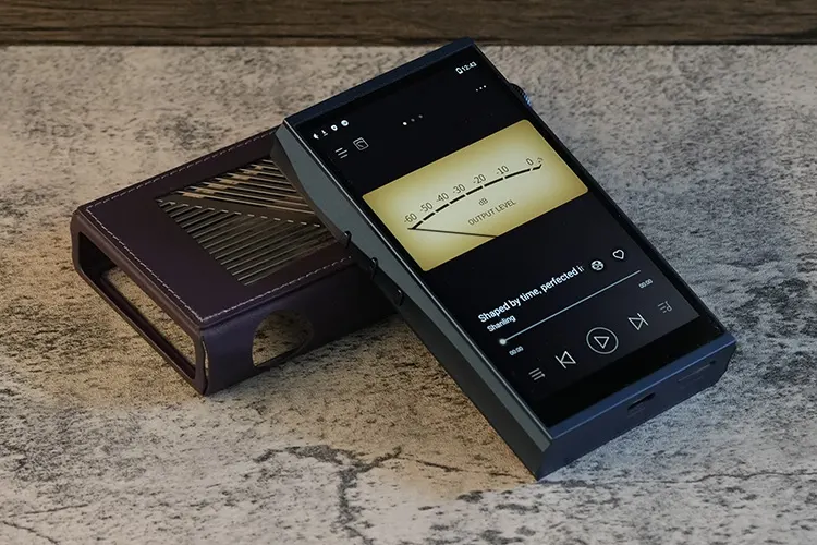 Shanling M7T on top of leather case with VU meter screen