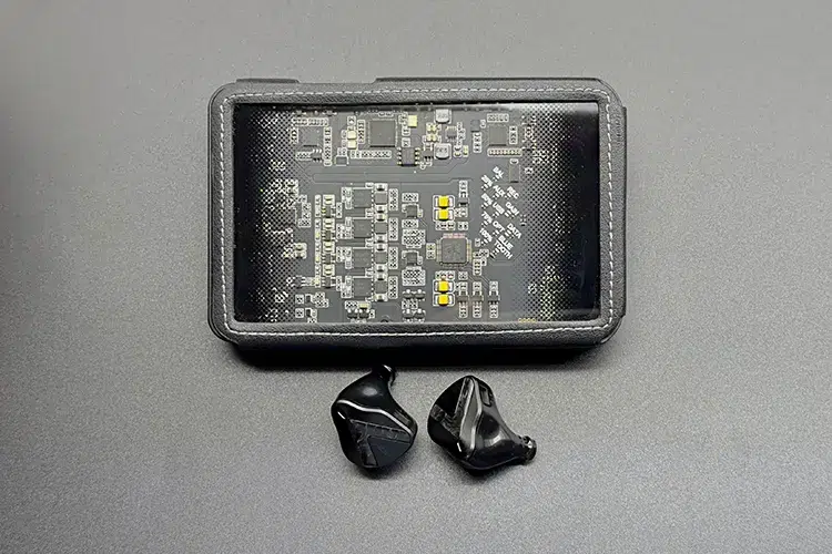 Softears RSV-MKII shells below Questyle CMA18P portable amplifier