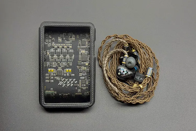 THIEAUDIO Monarch MKIV beside the Questyle CMA18P portable amplifier