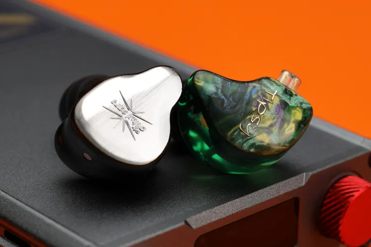 Tipsy M3 IEM shell beside the Kiwi Ears KE4 IEM shell