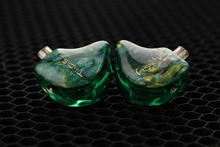 Tipsy M3 IEM shells on black honeycomb background