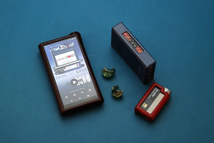 Tipsy M3 IEMs beside a DAP and 2 dongles