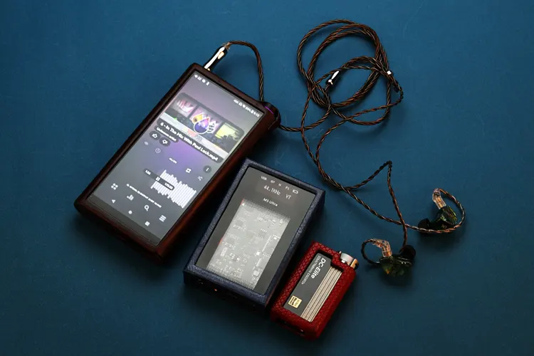 Tipsy M3 IEMs connected to a DAP and beside 2 dongles