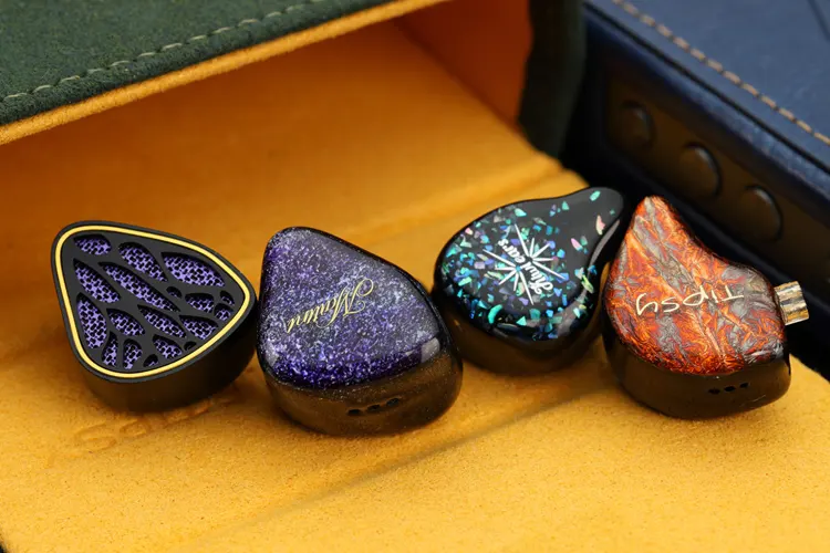 Tipsy M5 shell beside 3 other IEM shells