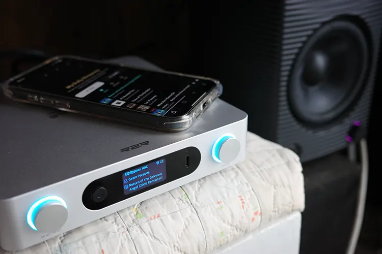 FiiO BR15 R2R near a speaker with a smartphone on top