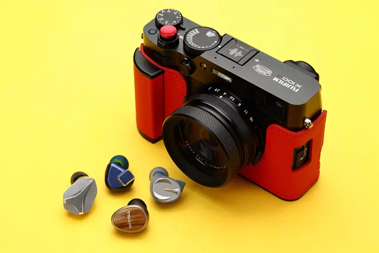 SIVGA Nightingale PRO beside other IEMs and a Fuji X100IV camera