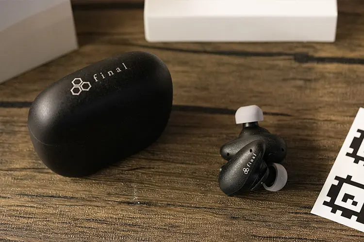 final TONALITE TWS beside its black cradle