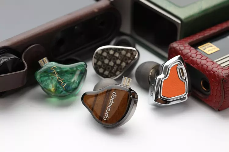 FiiO JH13 beside 3 other IEMs