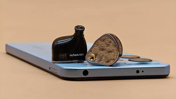 INAWAKEN Twilight-DS shells on top of blue smartphone