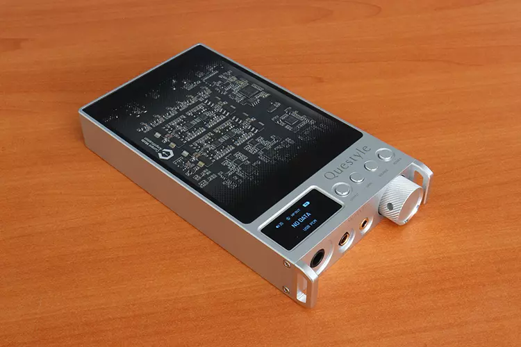 Questyle SIGMA Pro on a table powered up