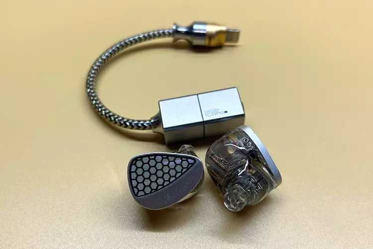 Kiwi Ears Orchestra II beside a ddHiFi dongle