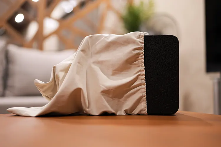 PMG Audio Apx ME case and cloth cover on a table